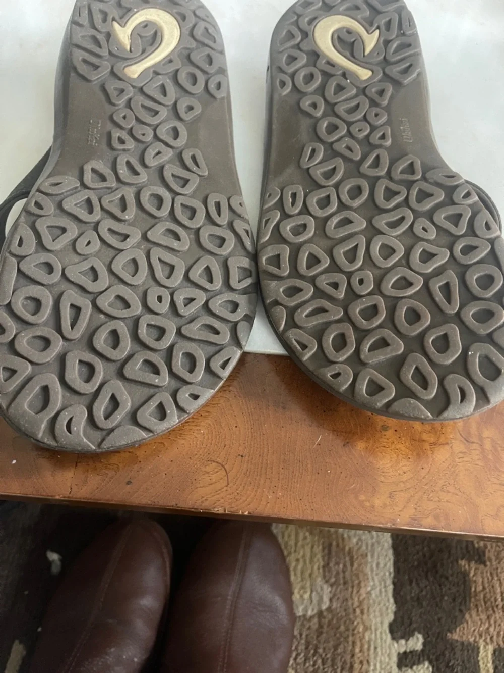 OluKai Dark Brown Leather Thong Sandals with Tan Stitching